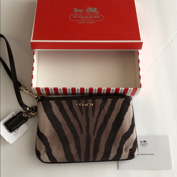 Coach Handbags - Coach zebra print wristlet. New with tag